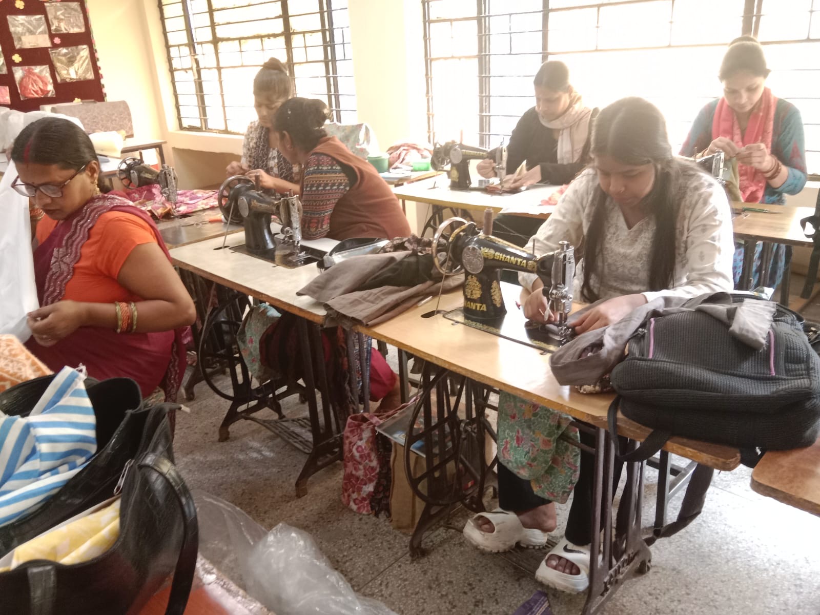 Women learning sewing and tailoring skills