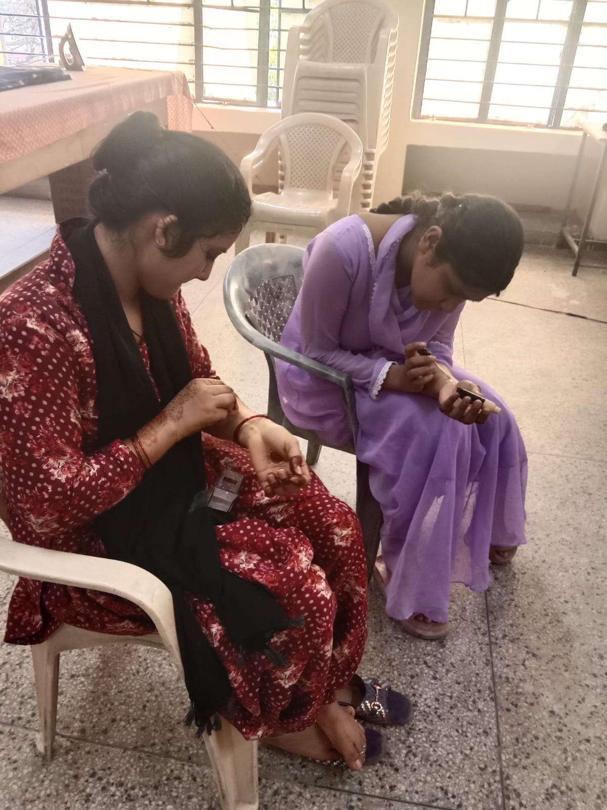 Women engaged in tailoring workshop